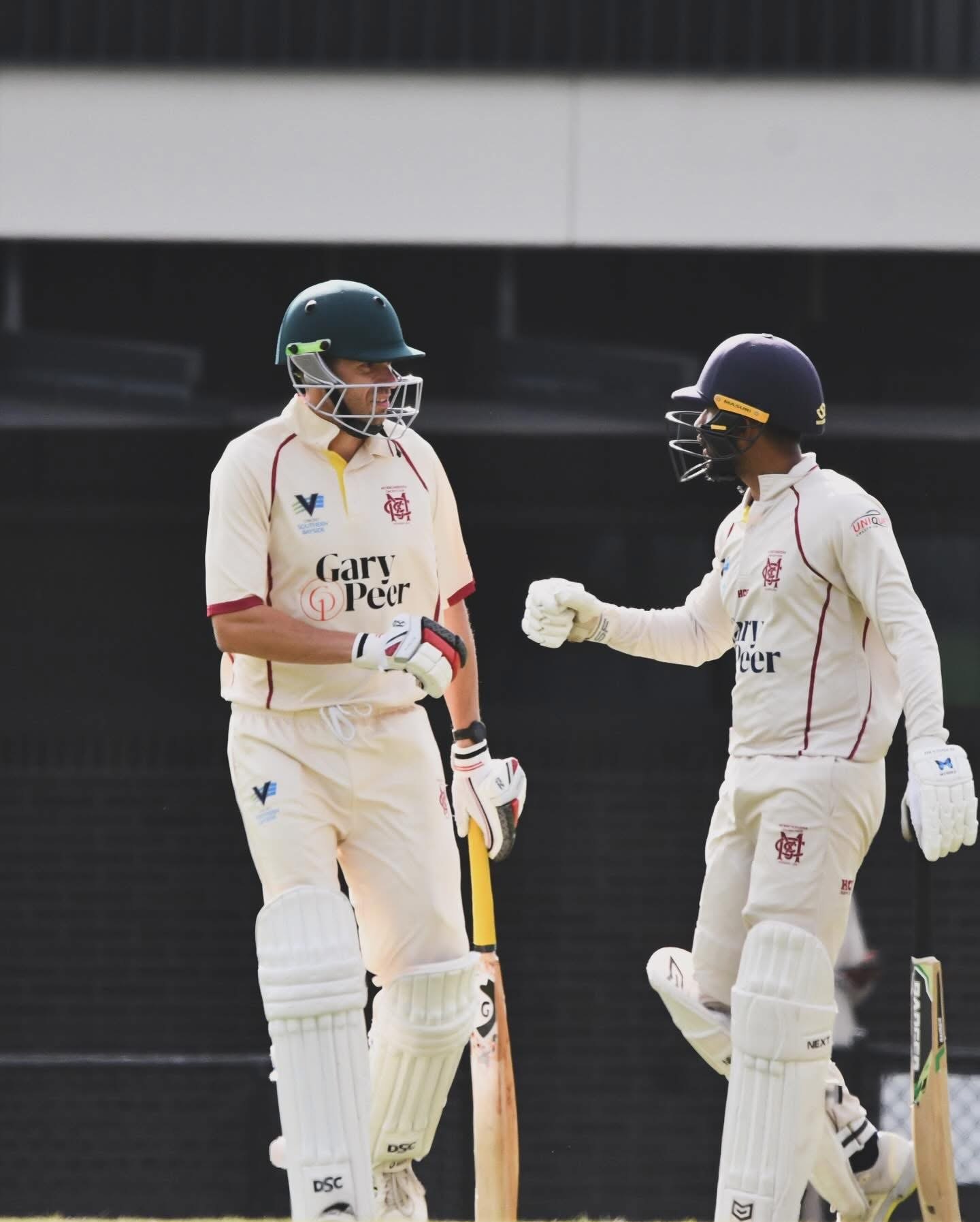 Cricket teammates fist bump