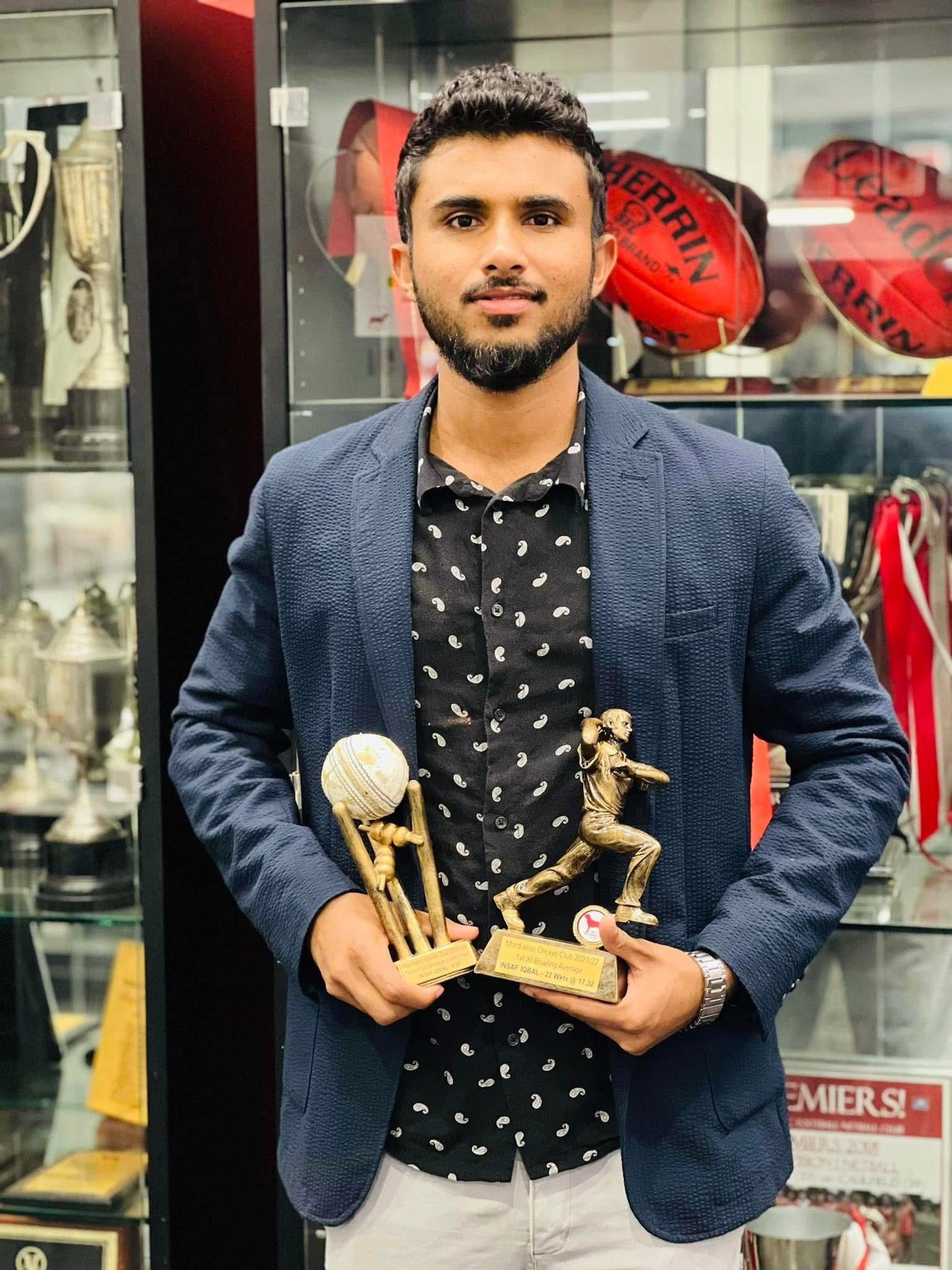 Insaf Iqbal with cricket trophies